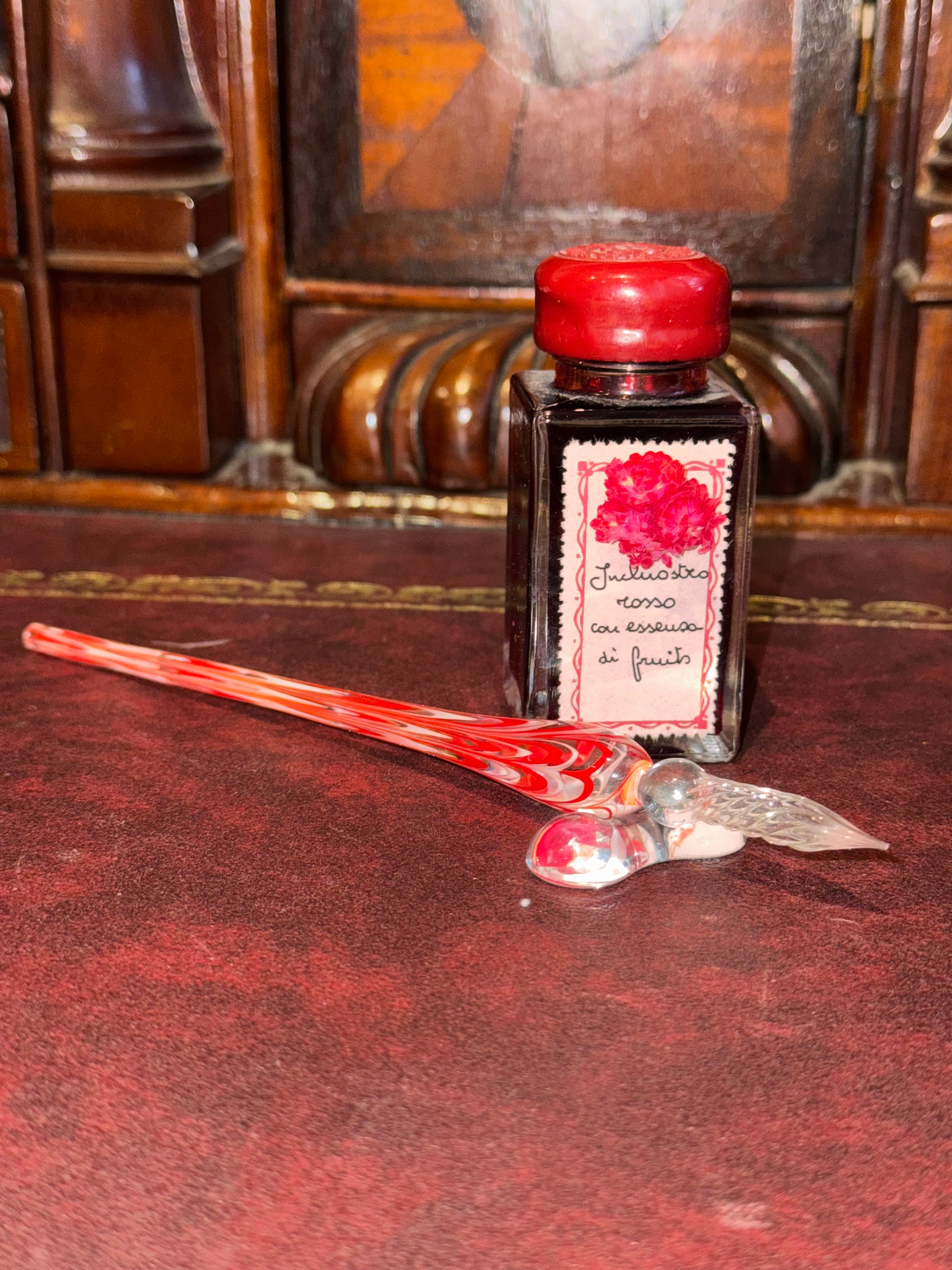 red and white glass dip pen
